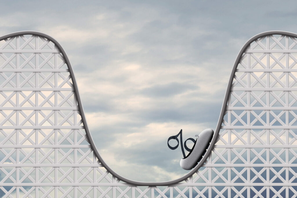 Roller coaster depicting a percentage sign indicating interest rates rising